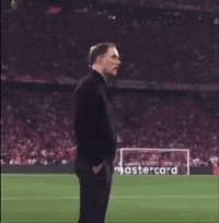 Man on Soccer Field With Mastercard Sign