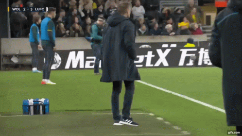 Man On Soccer Field With Maxi Advertisement GIF