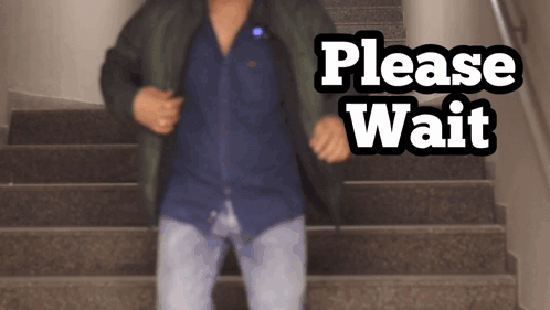 Man on Stairs Saying Please Wait