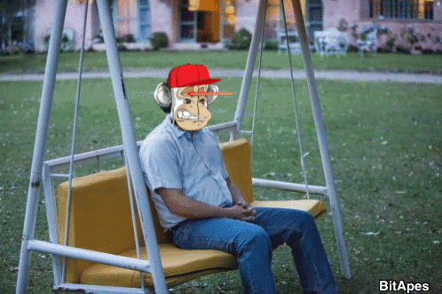 Man on Swing with Monkey on Face