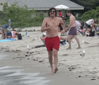 Man On The Beach Power Walking GIF