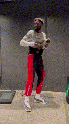 Man on Treadmill Holding Wii Controller