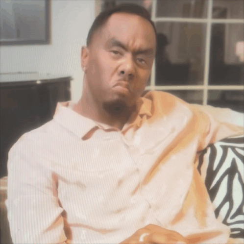 Man On Zebra Print Couch Making Funny Face GIF