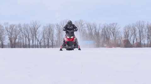 Man Operating A Snowmobile Front View GIF