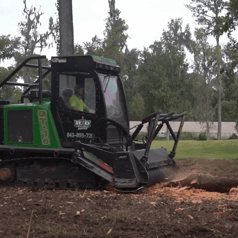 Man Operating Machine To Produce Mulch GIF