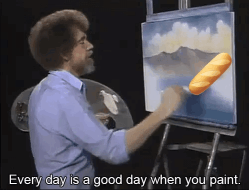 Man Painting With Bread in Hand