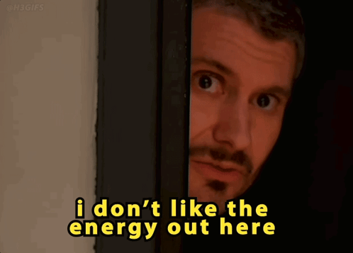 Man Peeking Behind Door Saying I Don't Like the Energy Out Here