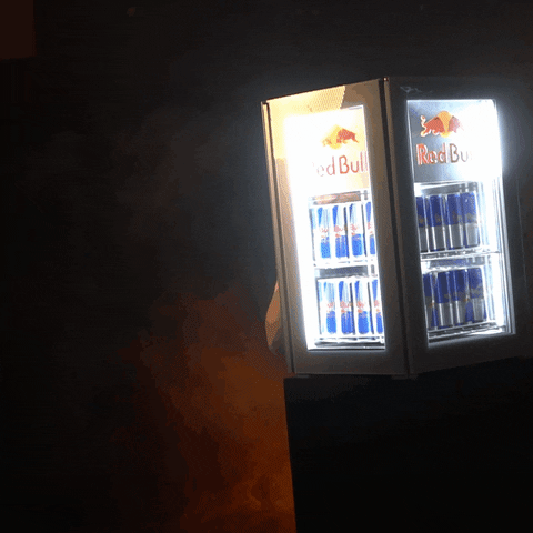 Man Peeking Behind Fridge Full Of Red Bull GIF