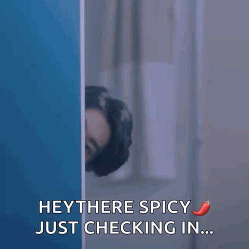 Man Peeking Behind Wall Saying Hey There Spicy