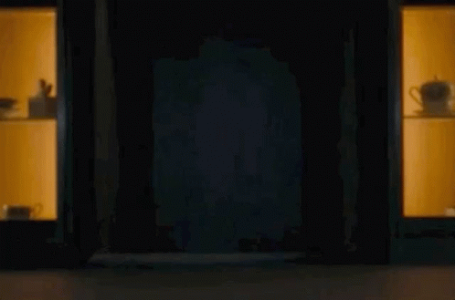 Man Peeking From Dark Room GIF