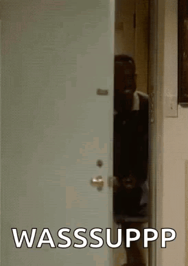 Man Peeking Out of Door With Wasssuppp