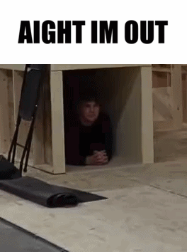 Man Peeking Out of Wooden Box