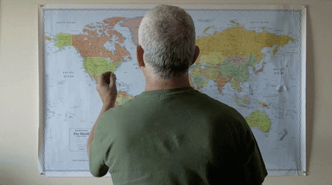 Man Pinning Travel Map GIF