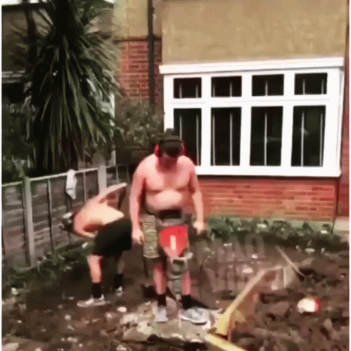 Man Placing A Jackhammer Under His Belly GIF