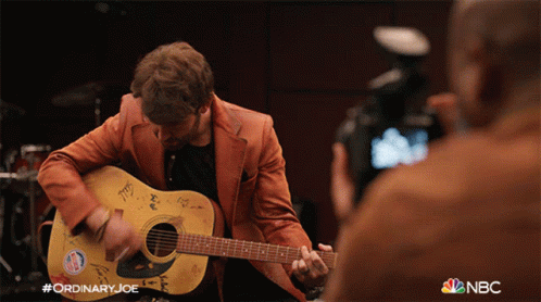 Man Playing Acoustic Guitar