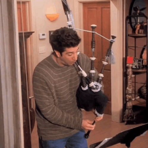 Man Playing Bagpipe on Exercise Bike