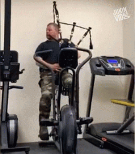 Man Playing Bagpipe on Exercise Bike