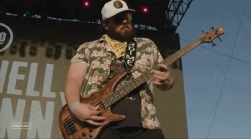 Man Playing Bass Guitar With rdtime Strap