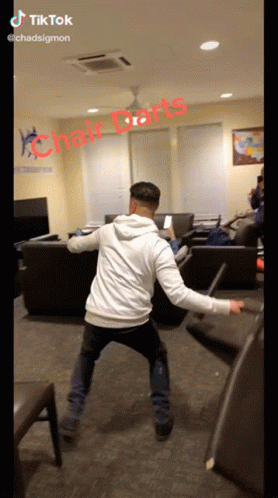 Man Playing Chair Darts
