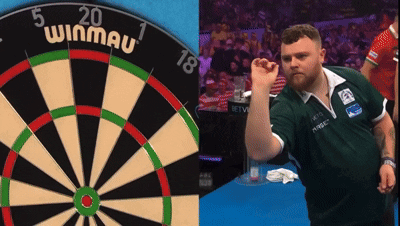 Man Playing Darts With Winmau Dart Board