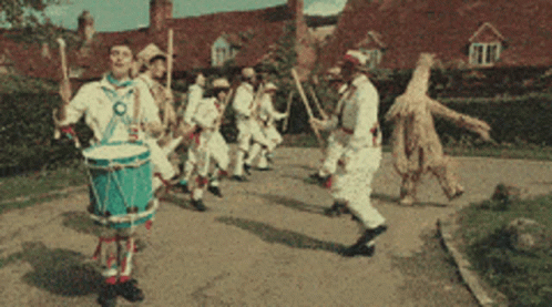 Man Playing Drum In Parade GIF