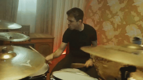Man Playing Drum Set with Cymbal Saying A