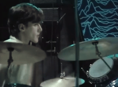 Man Playing Drums On Blue Stage GIF