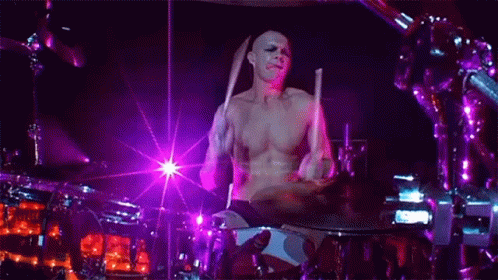 Man Playing Drums on Stage