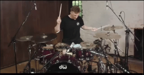 Man Playing Drums With DW Drum Set