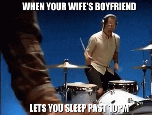 Man Playing Drums With Headphones on Blue Background