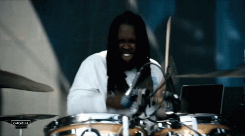 Man Playing Drums With Screen Saying Campbella GIF