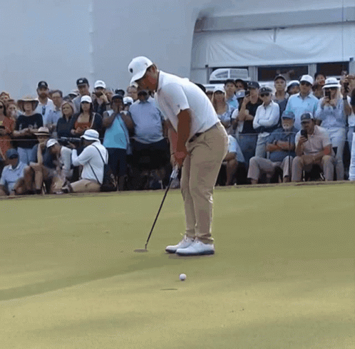 Man Playing Golf In Front Of Crowd GIF