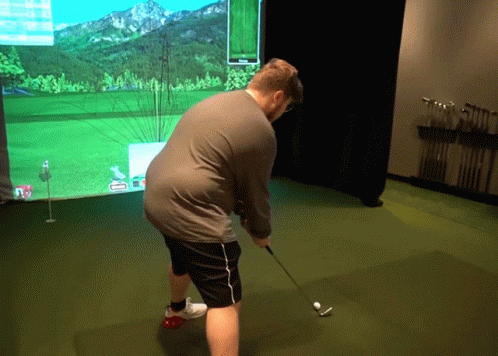 Man Playing Golf with Screen Showing A