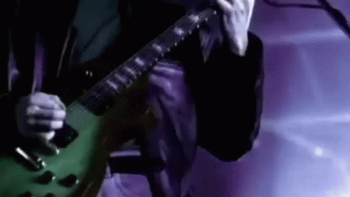 Man Playing Green Electric Guitar GIF