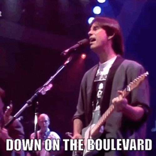 Man Playing Guitar And Singing On Stage GIF