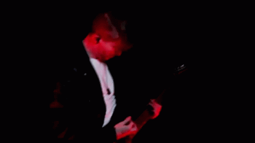 Man Playing Guitar In Dark Room GIF
