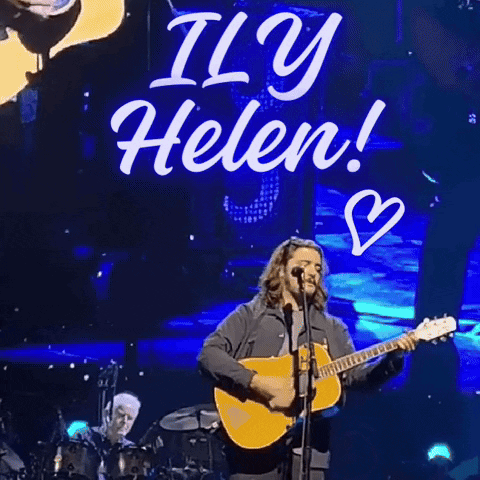 Man Playing Guitar In Front Of It's Helen Sign GIF
