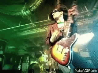 Man Playing Guitar on Stage