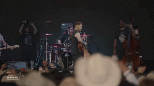 Man Playing Guitar on Stage