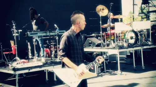 Man Playing Guitar on Stage