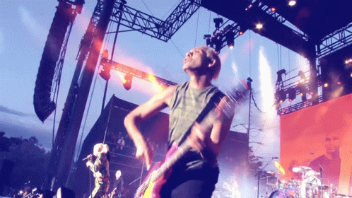 Man Playing Guitar on Stage