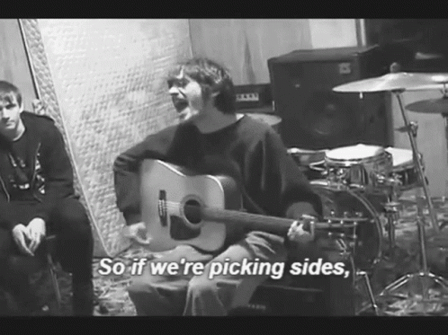 Man Playing Guitar Saying Picking Sides