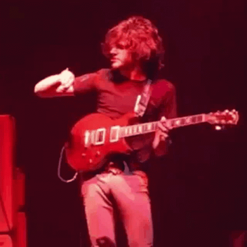 Man Playing Guitar With 100