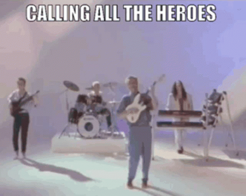 Man Playing Guitar with Band Calling All the Heroes