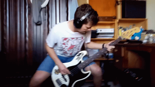 Man Playing Guitar with Headphones