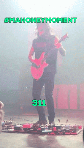 Man Playing Guitar With Number 311