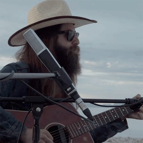 Man Playing Guitar With Sennheiser Microphone