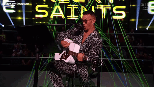 Man Playing Guitar With We Believe In Ricky GIF