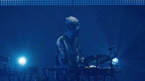 Man Playing Keyboard With Letter X on Jacket