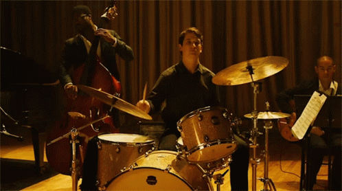 Man Playing Maple Drum Set